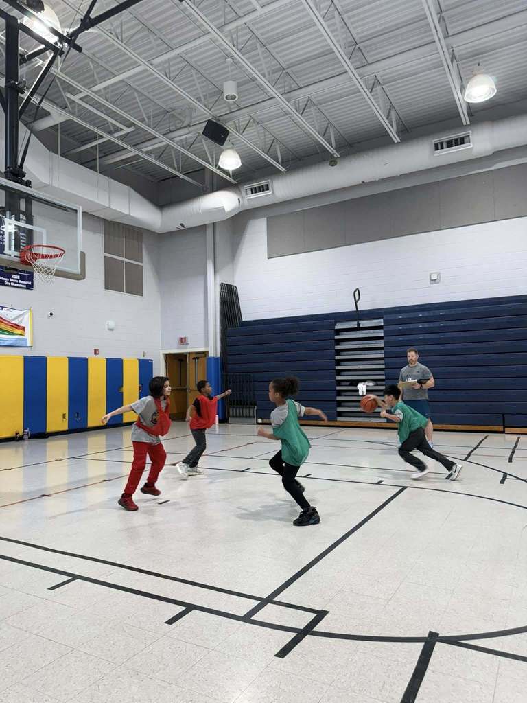 Kids playing basketball in the JoAnna Connell gym. 