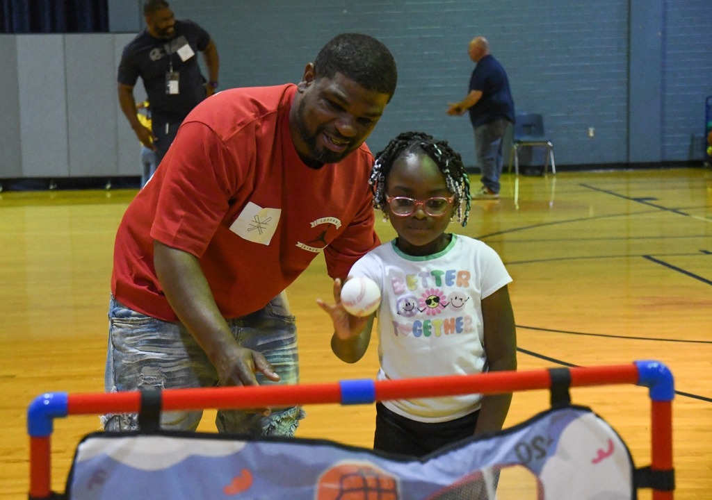 father and daughter playing baseball activities