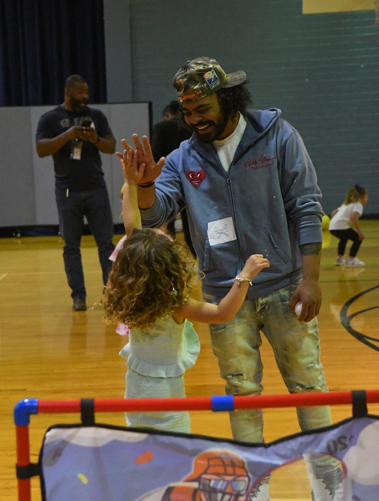 man and daughter high fiving
