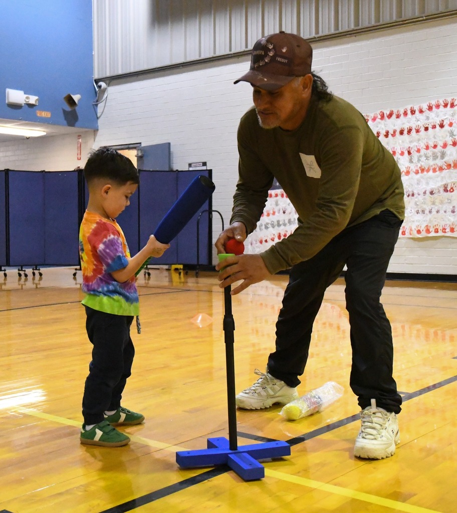 man and son playing baseball activities