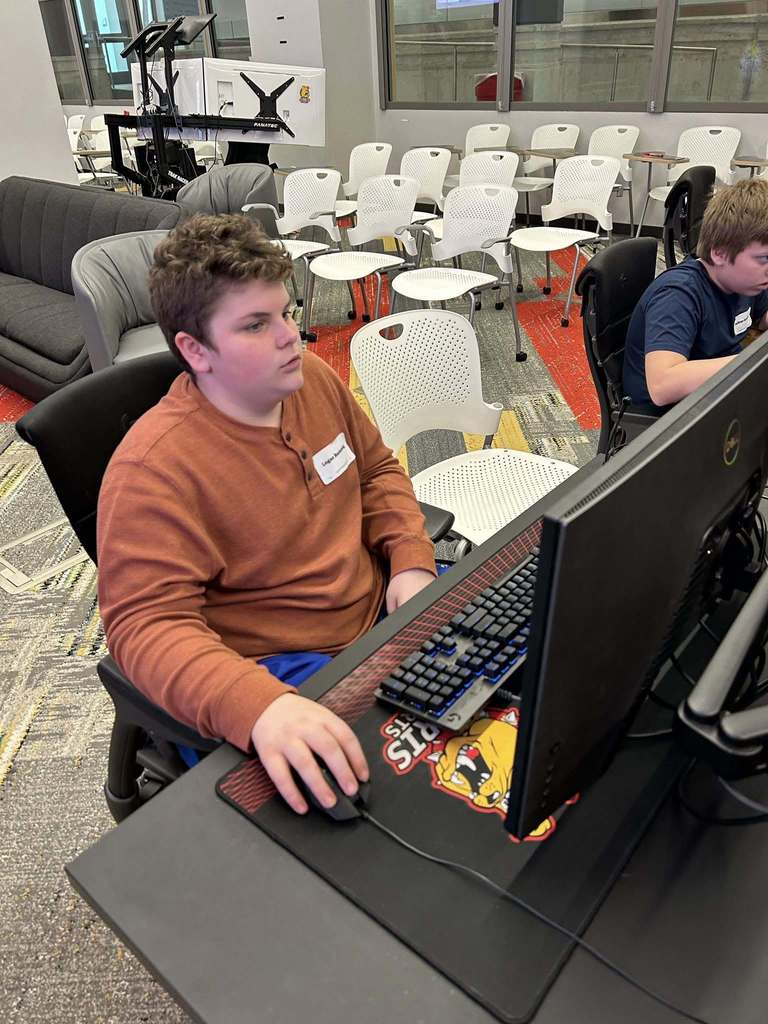 Tri County Middle School student working on a computer at Cyber Security Day at Ferris State University.