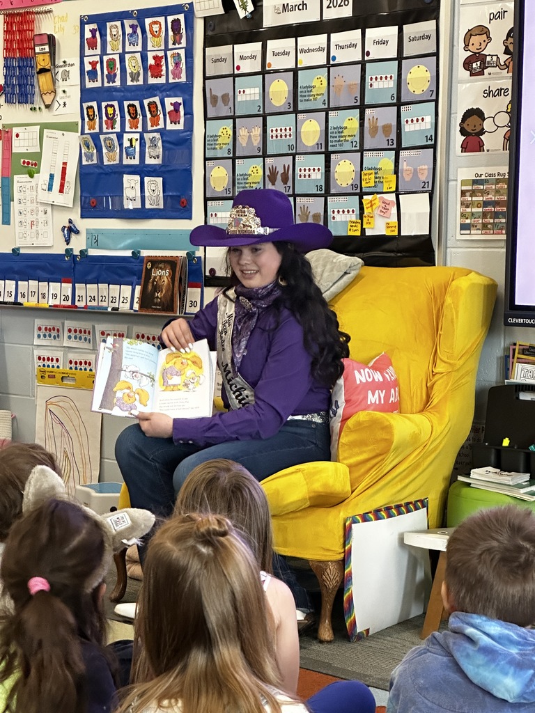 Miss Teen Rodeo, Olivia Bucholtz, reading a book to kindergarten students.