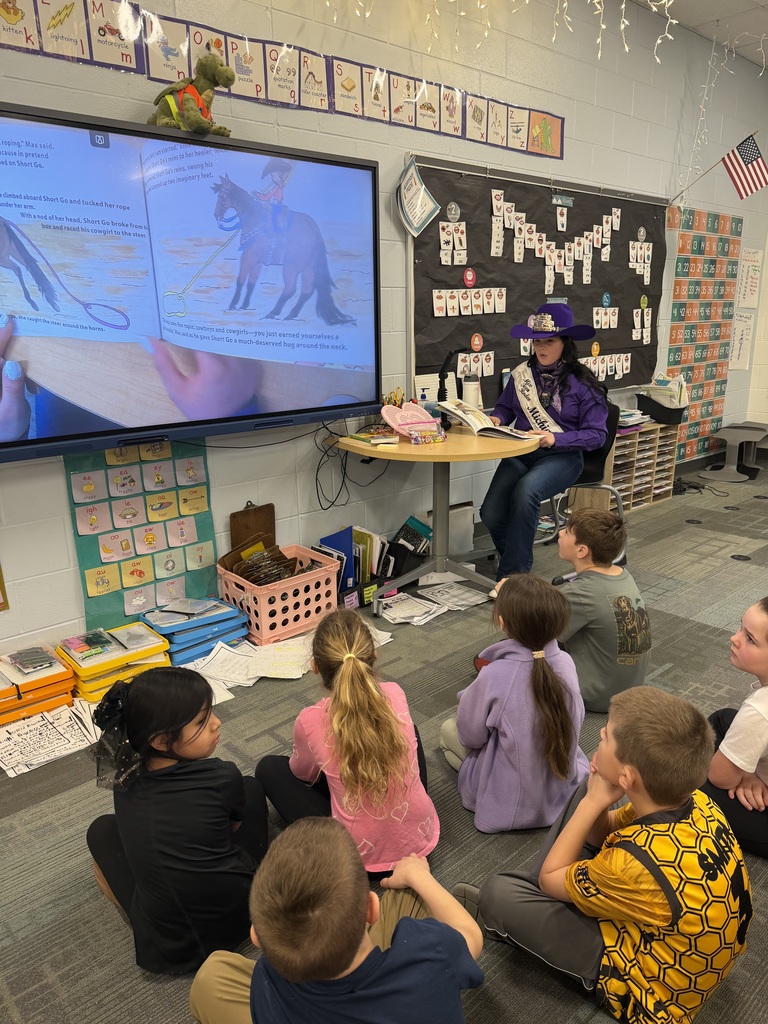 Miss Teen Rodeo, Olivia Bucholtz, reading a book about horses to 2nd grade students.