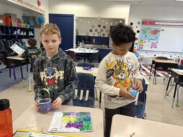 Students weaving baskets for easter in a classroom. 