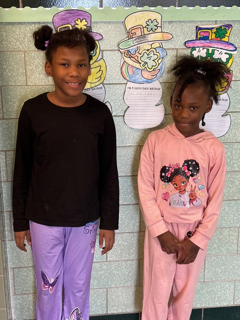 Two students posing for a photo. 