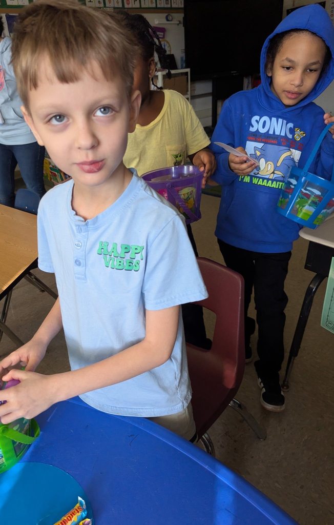 A young boy is posing for a photo.