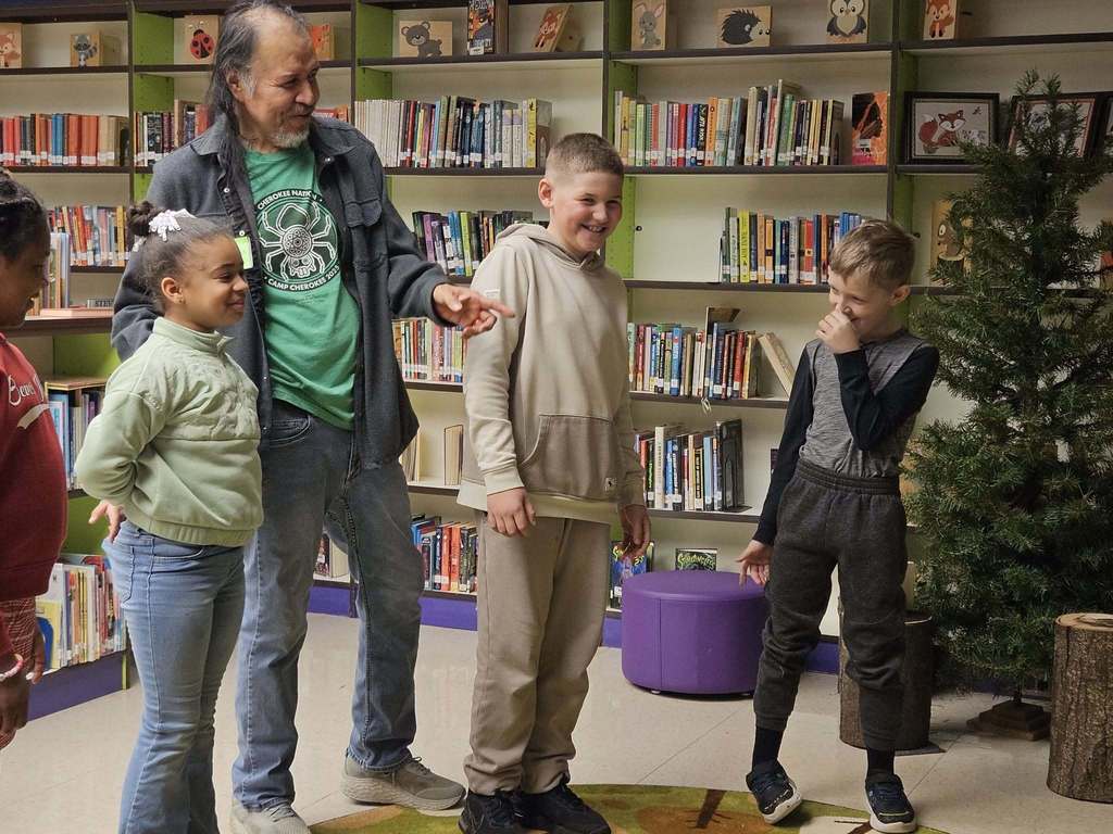 Robert Lewis is talking to students. 