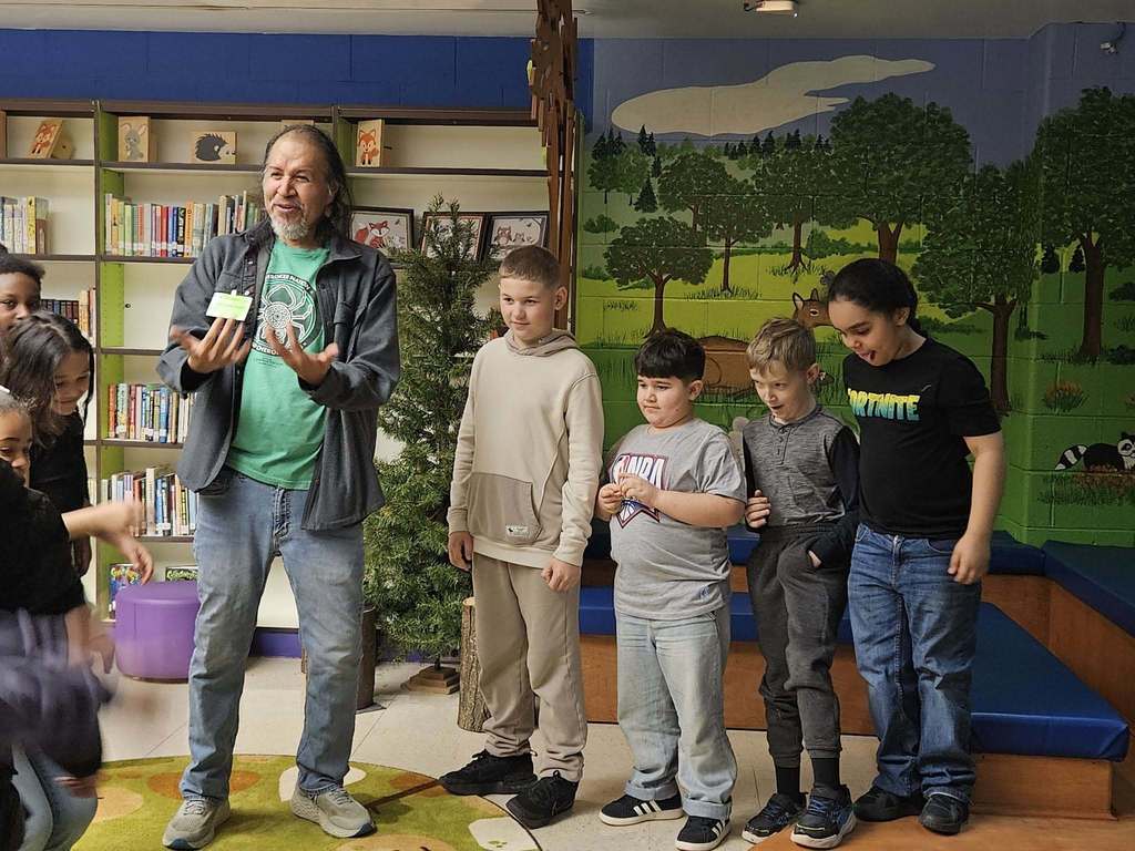 Robert Lewis is talking to students. 