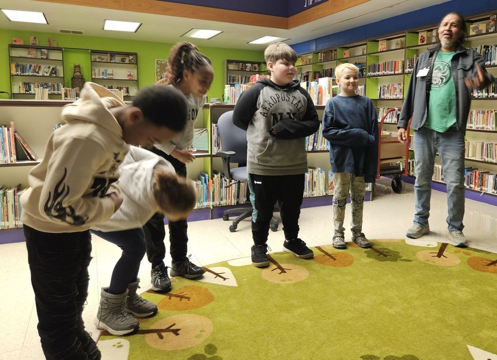 Robert Lewis is talking to students. 