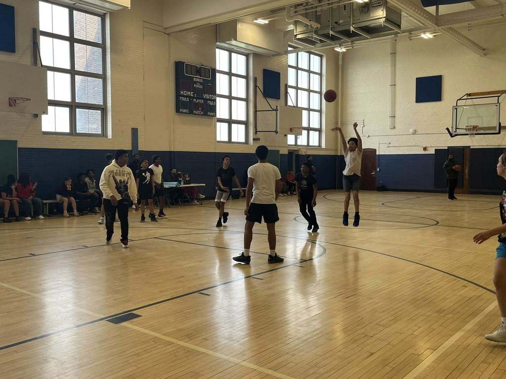 Students playing basketball. 