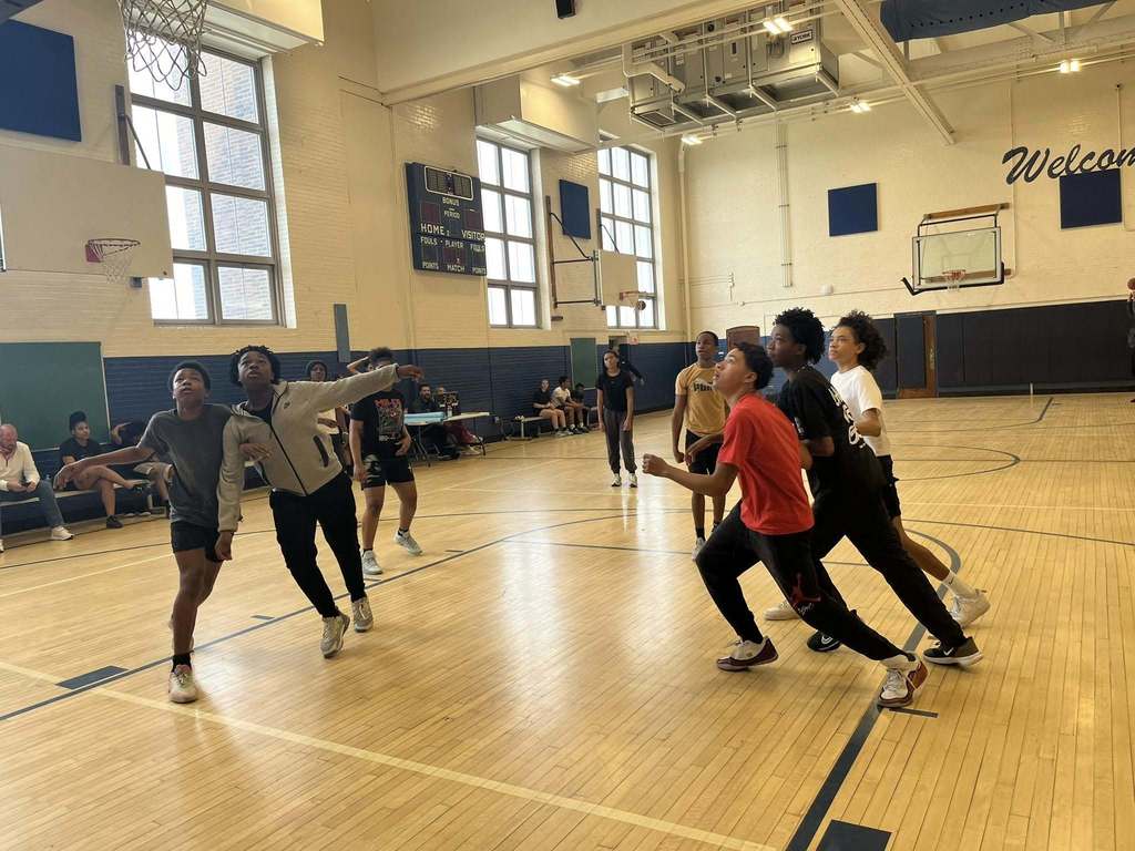 Students playing basketball. 