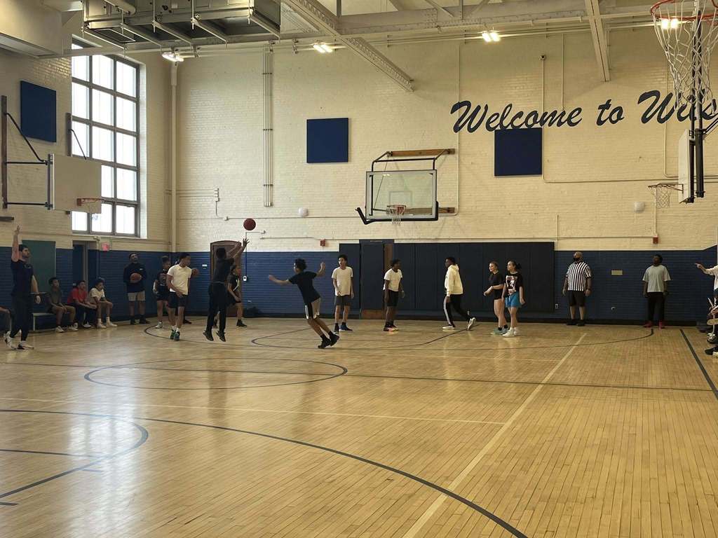 Students playing basketball. 