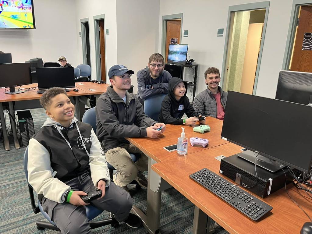 Students playing video games with students from Penn State Behrend. 
