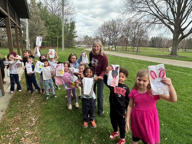 Mrs. Boccieri's class holding up their easter bags