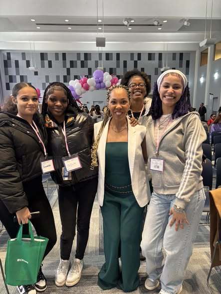 A group of women posing. 