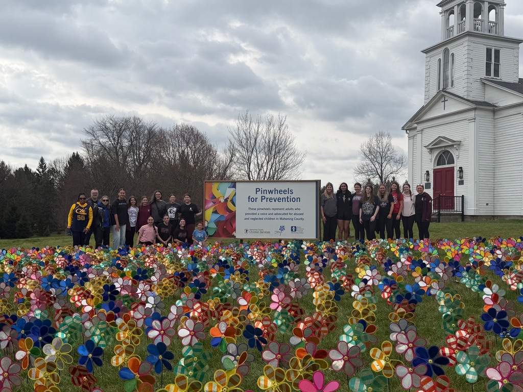 group photo with pinwheels for prevention garden 
