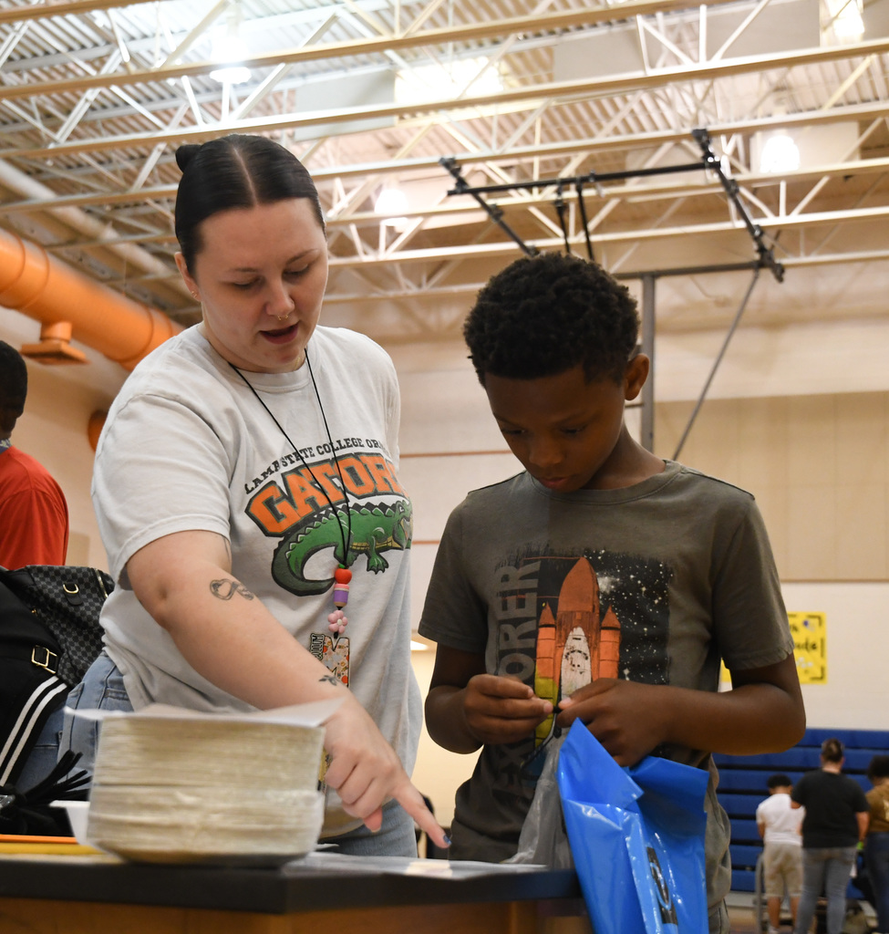 teacher helping student with a problem
