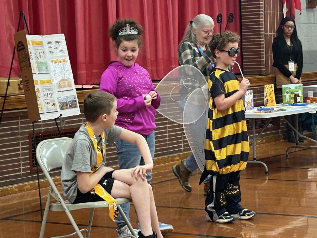 girl dressed like queen bee with boys as drone and worker bee