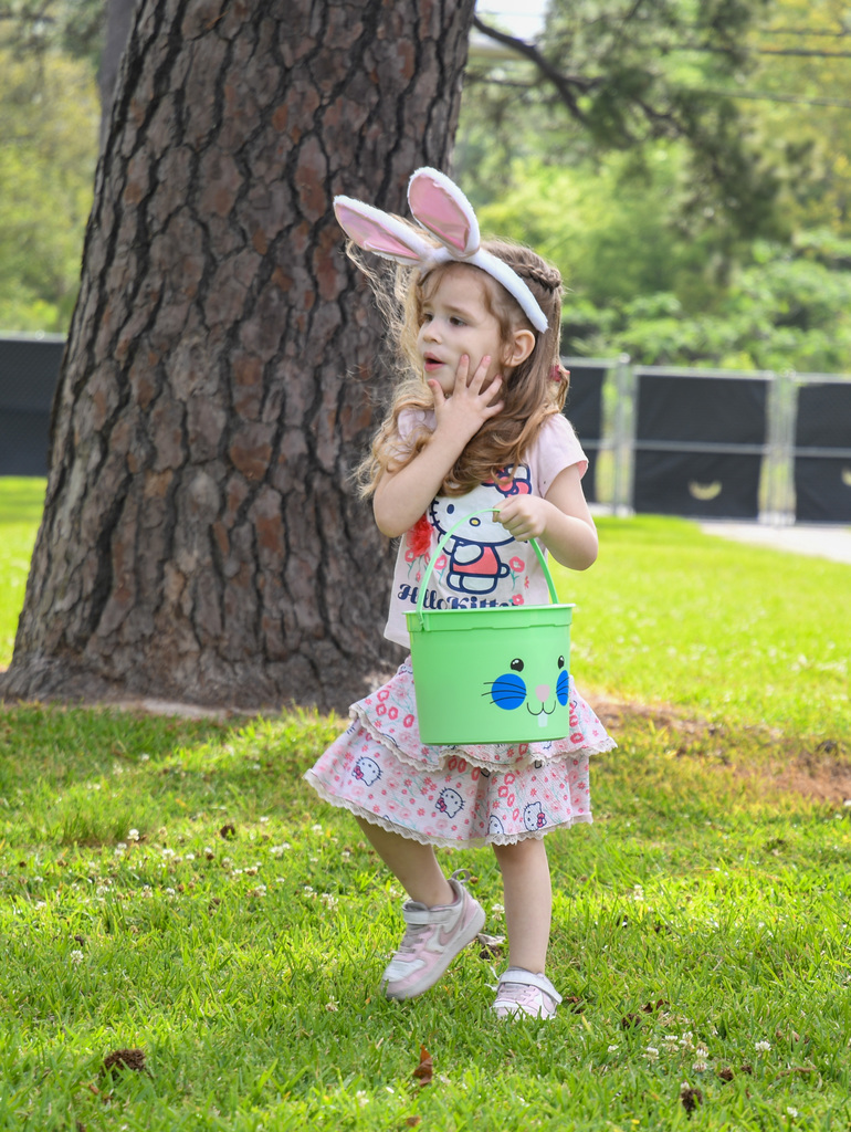 girl hunting for easter eggs