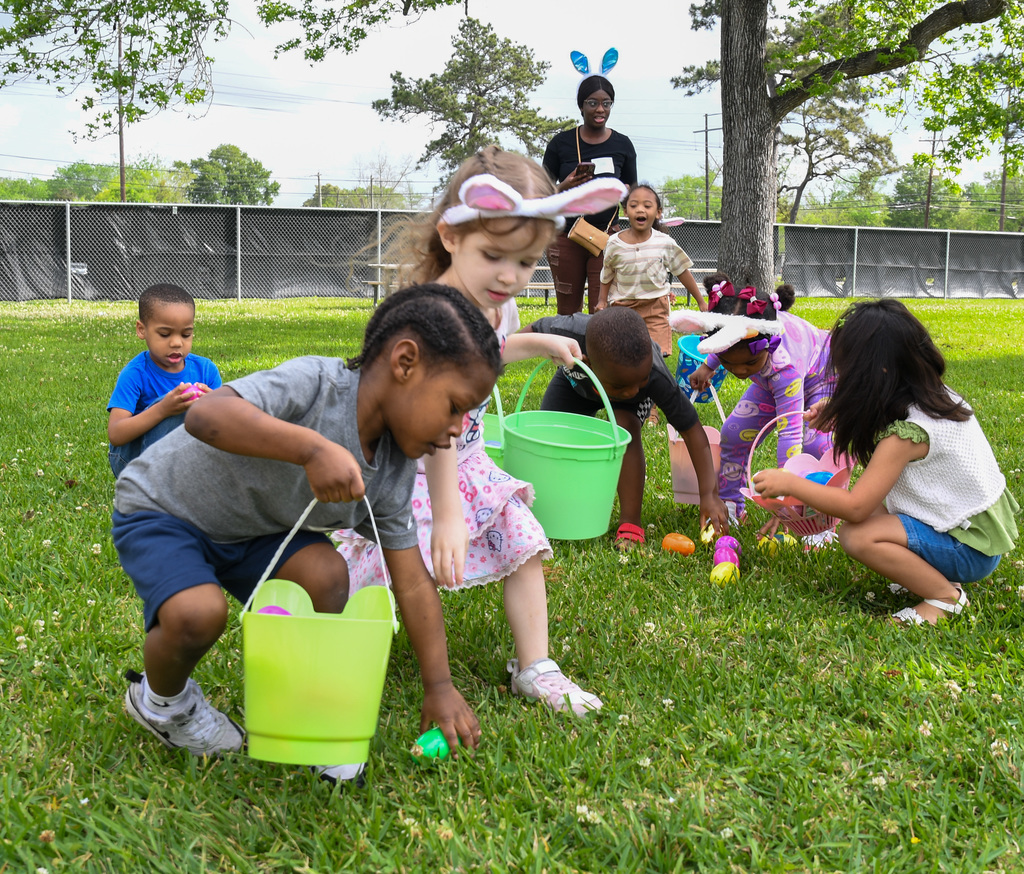 students hunting for easter eggs