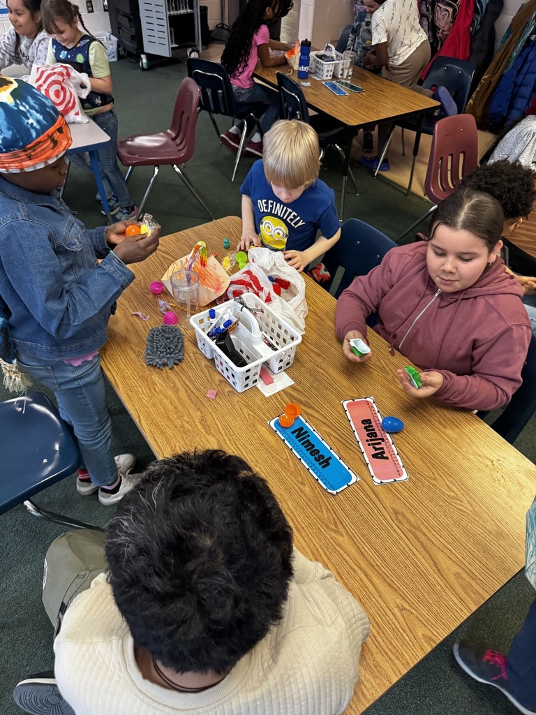 Students opening easter eggs. 