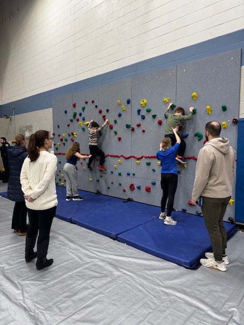 children on climbing wall
