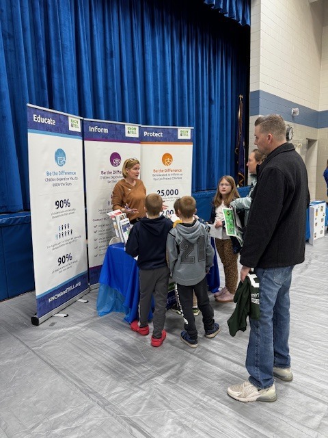 children visiting Know & Tell table