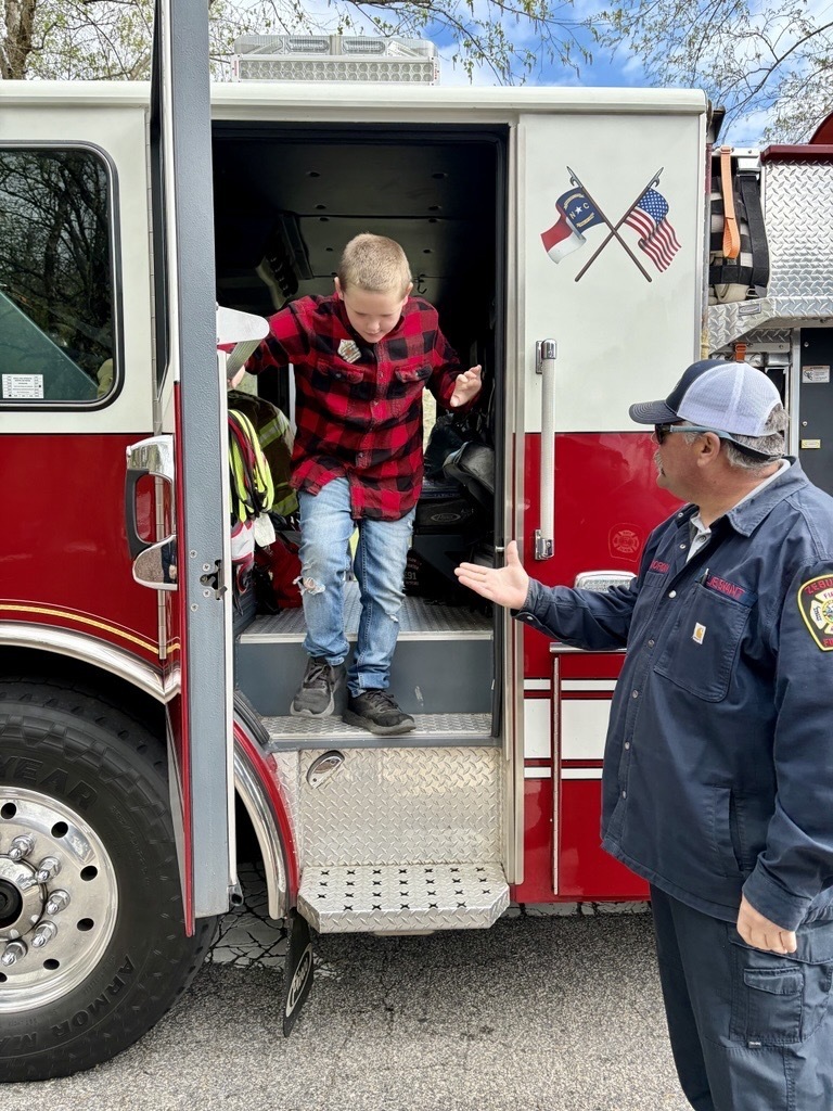 kid and a firetruck