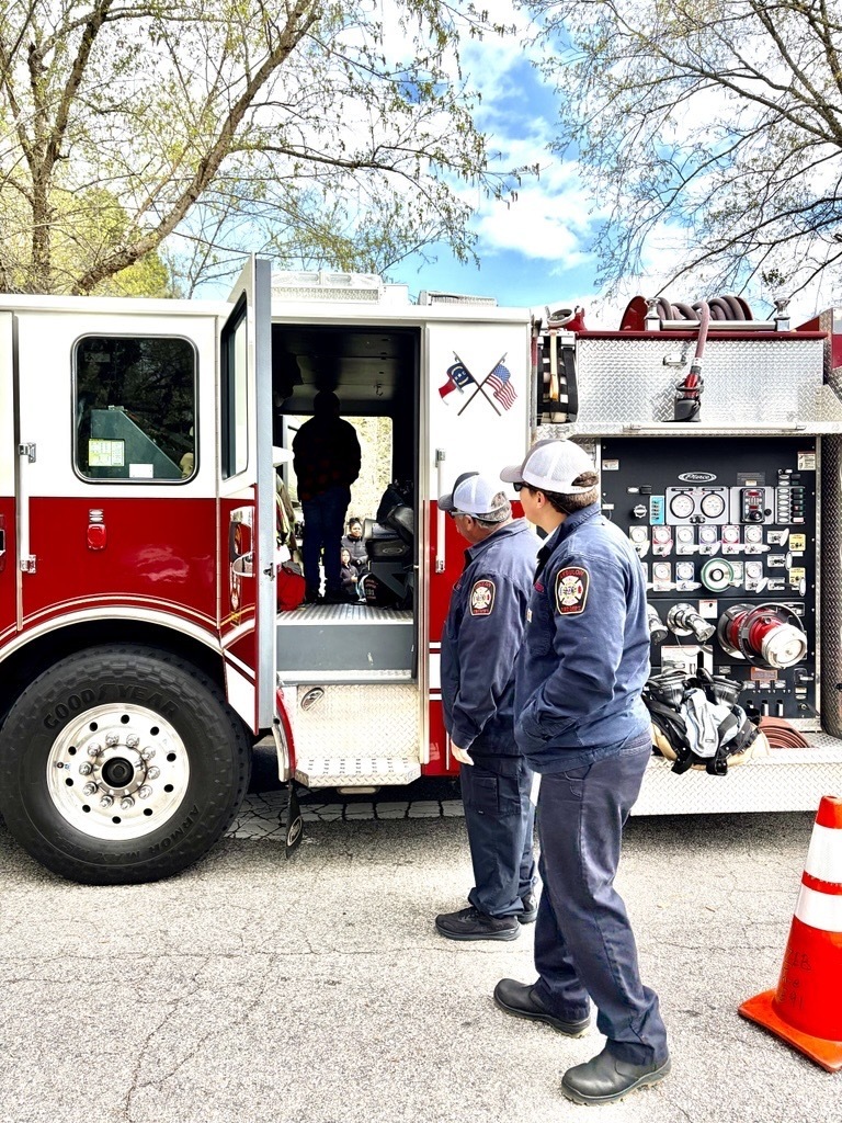 kid and a firetruck