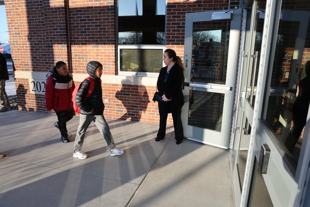 Edison Principal greeting students as they walk into the new Edison Elementary building. 