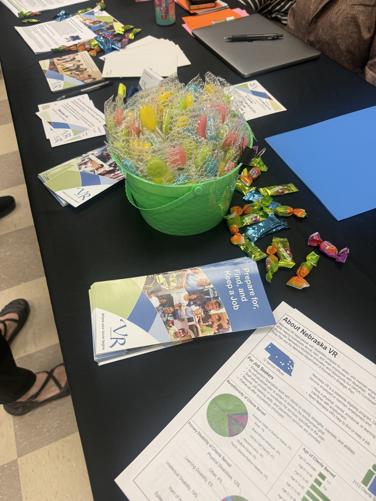 pamphlets with information about Vocational Rehabilitation laid out on a job fair table