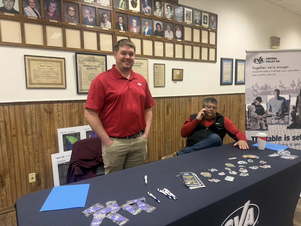 two men at a job fair booth table  for Central Valley Ag