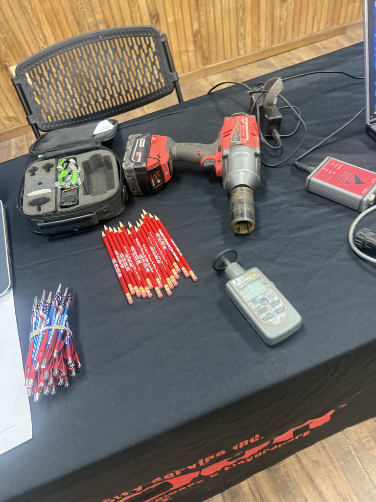 power tools and pencils on a job fair booth table