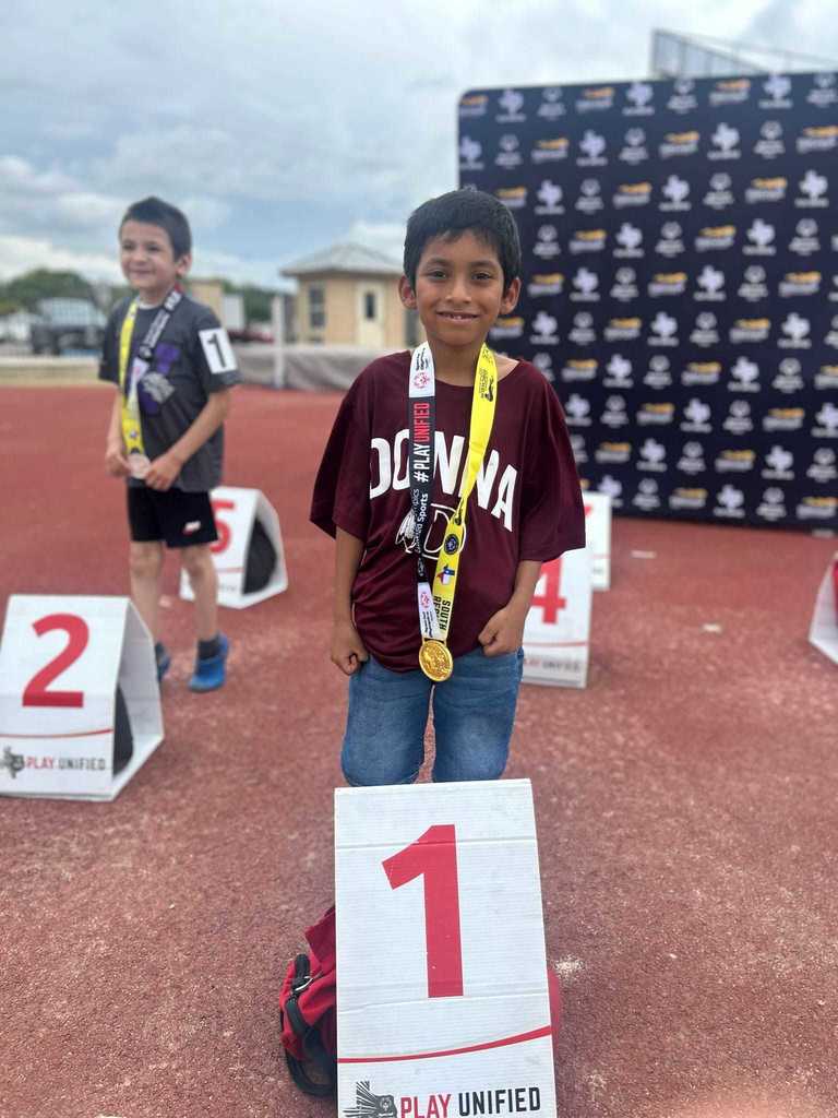 boy maroon shirt first place