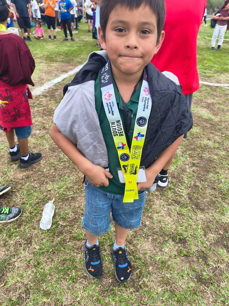 boy green shirt medal 
