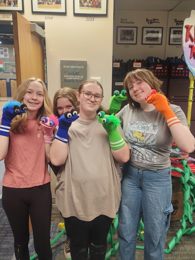 4 girls showing off their sock puppets