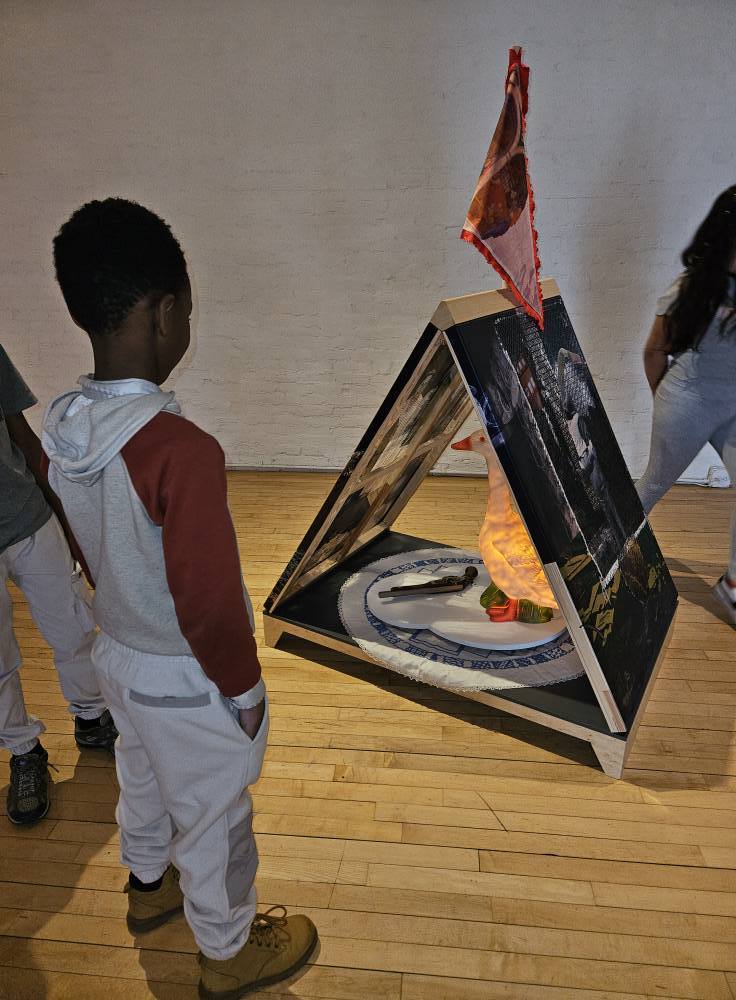 Students looking at artwork in the Erie Art Museum. 