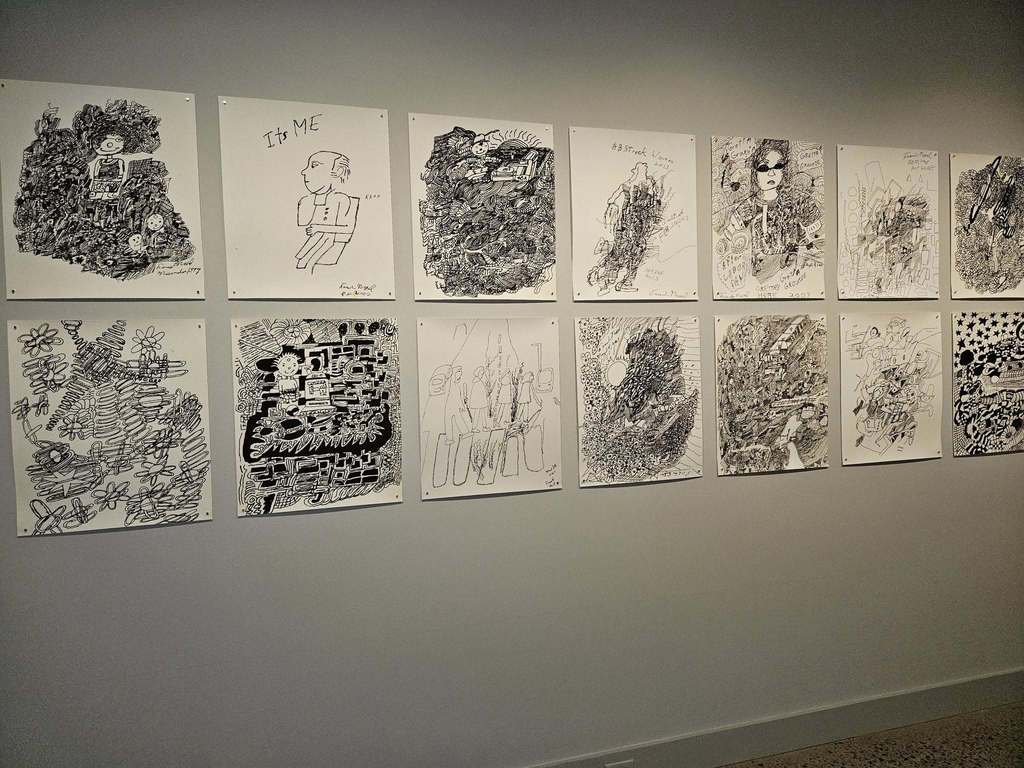 ABlack and white artwork on the wall in the Erie Art Museum. 