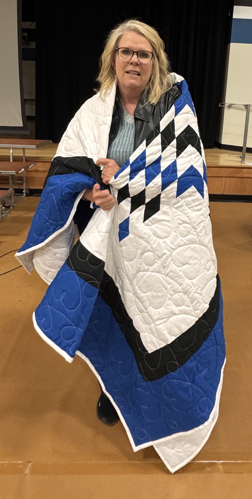 Mrs. Sandoz with star quilt