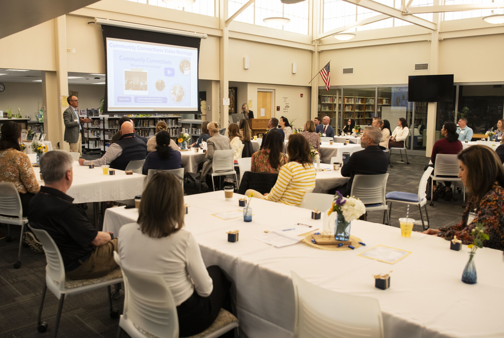 Superintendent Mar Bertrando greets a group of faculty, staff and community partners.