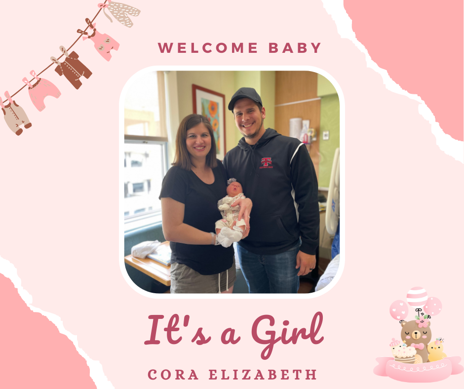 Stephen Monath and his wfie hold their new baby daughter.