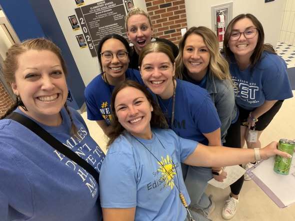 Teachers posing in the new Edison Building. 
