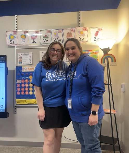 Teachers posing in the new Edison Building. 