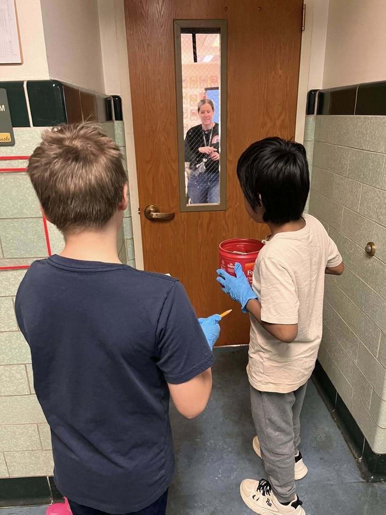 Students standing outside of a classroom. 