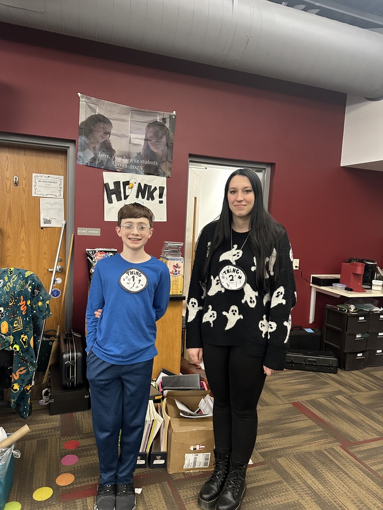 A student and teacher dressed up as thing 1 and thing 2