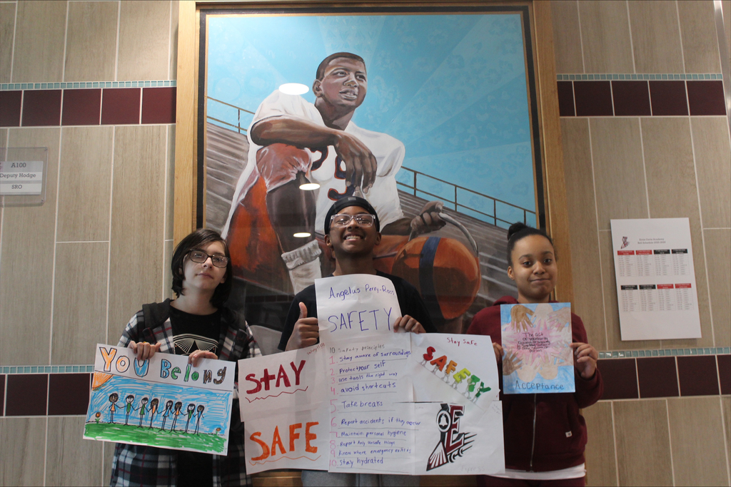 3 students with their posters