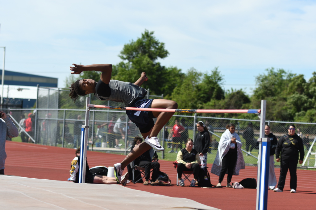 wos athlete mid jump in the high jump