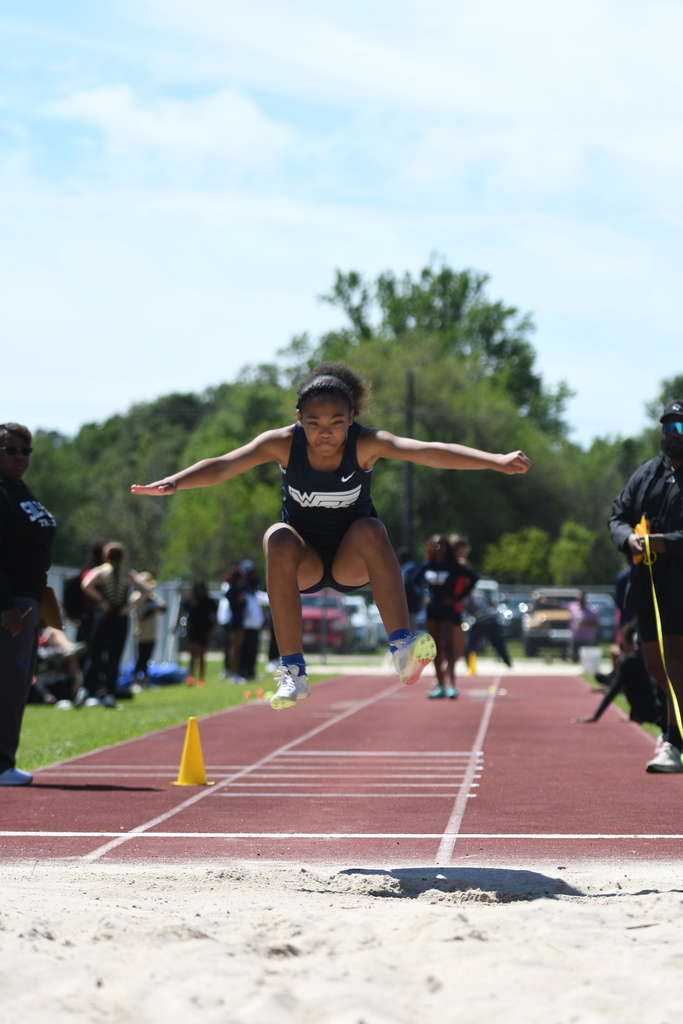 wos athlete leaping into sand