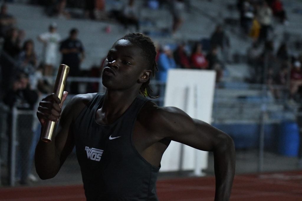 wos relay runner mid-stride