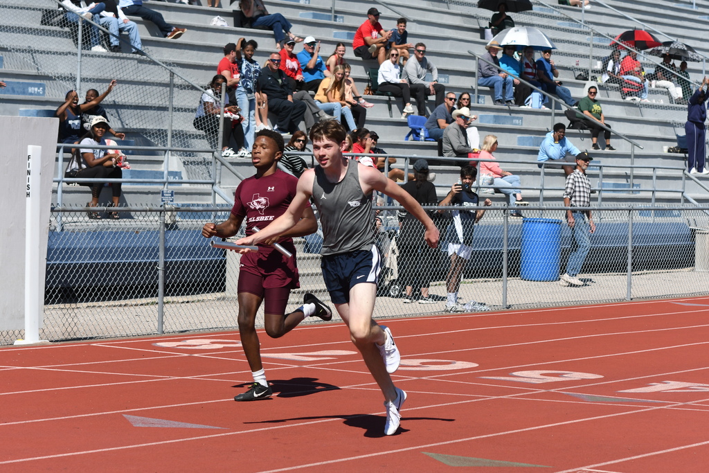 wos relay runner finishing race in first